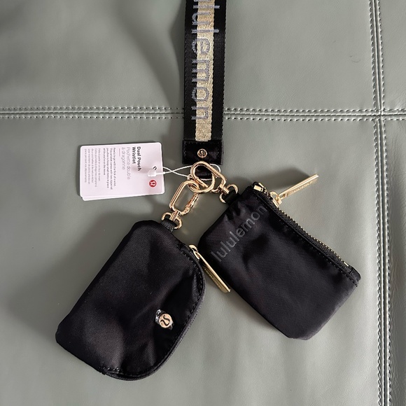 Lululemon black and gold wristlet dual pouch, one size. - Picture 1 of 5